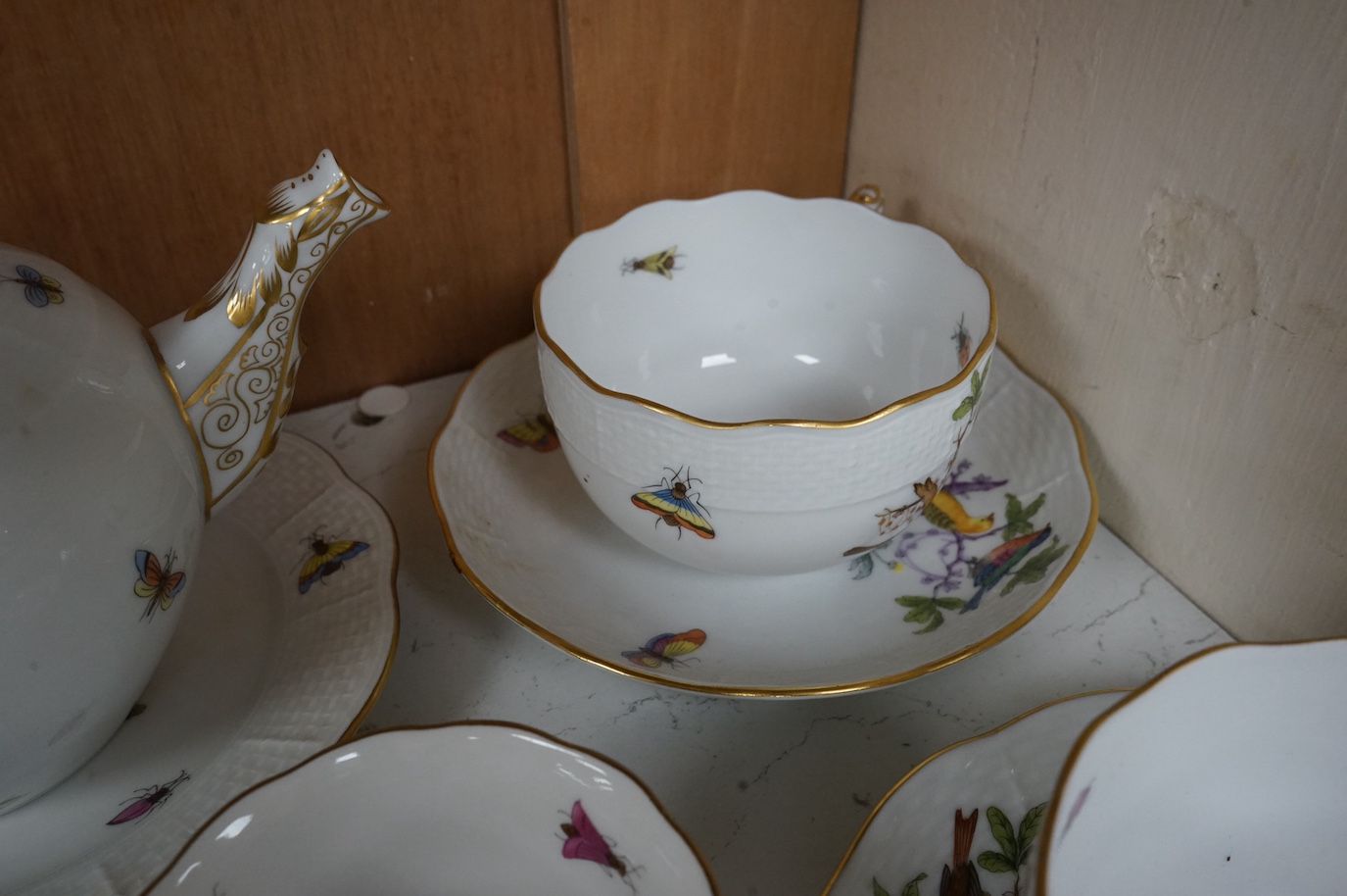 A Herend porcelain Rothschild Birds pattern tête-à-tête tea service, decorated with birds and butterflies. (8 piece's) teapot 10cm high